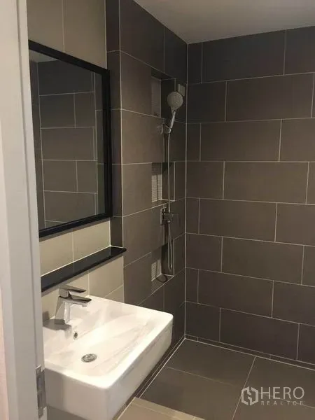 Detached House for sale in Pak Kret, Nonthaburi - Modern bathroom with gray tiled shower, wall niche and square basin