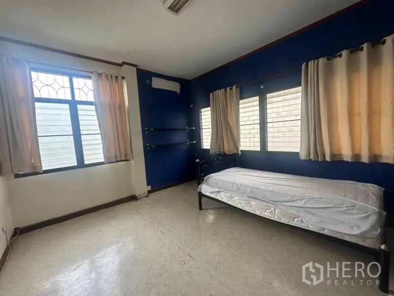 Office Space for rent - Simple staff room with bed and multiple windows