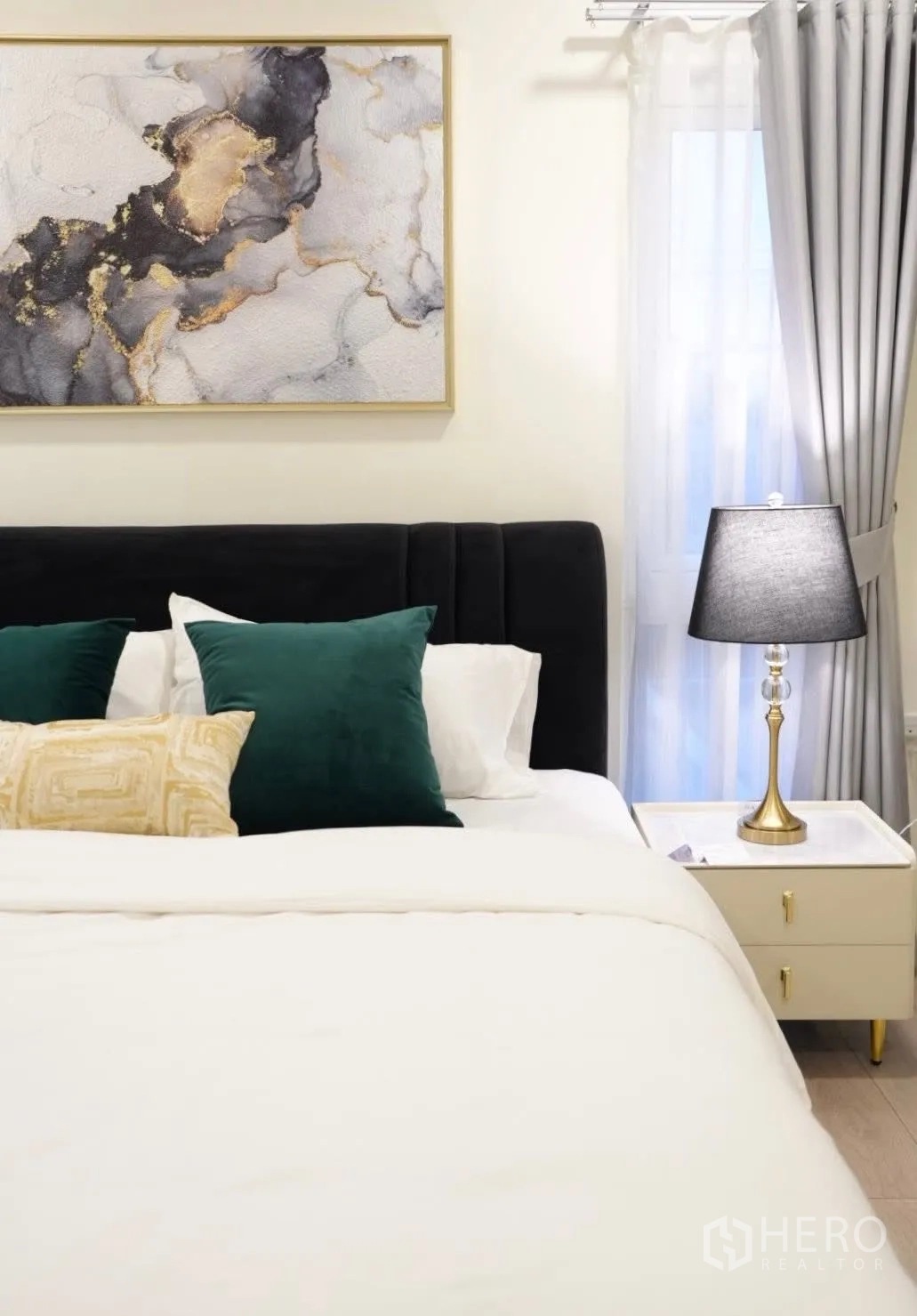 Detached House for rent in Bang Phli, Samut Prakan - Cozy master bedroom with velvet headboard, abstract wall art, bedside lamp and sheer curtains.