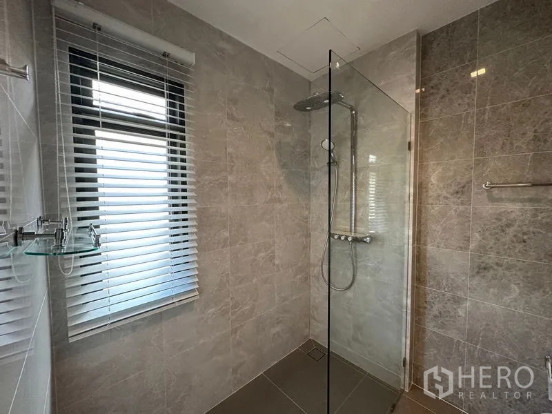 Detached House for rent or sale - Walk-in shower with rain head, frameless glass and marble-look wall tiles.
