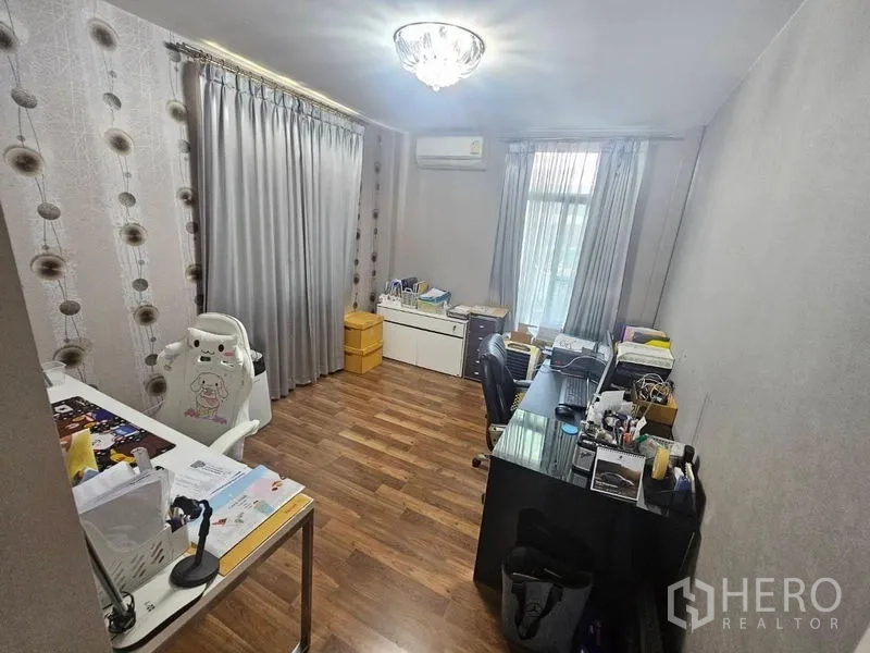 Detached House for sale in Prawet, Bangkok - Dedicated home office with desks, cabinets, window and wooden floor.