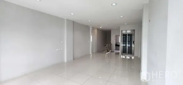 Home Office for rent - Spacious open-plan office floor with white tiles and recessed ceiling lights.