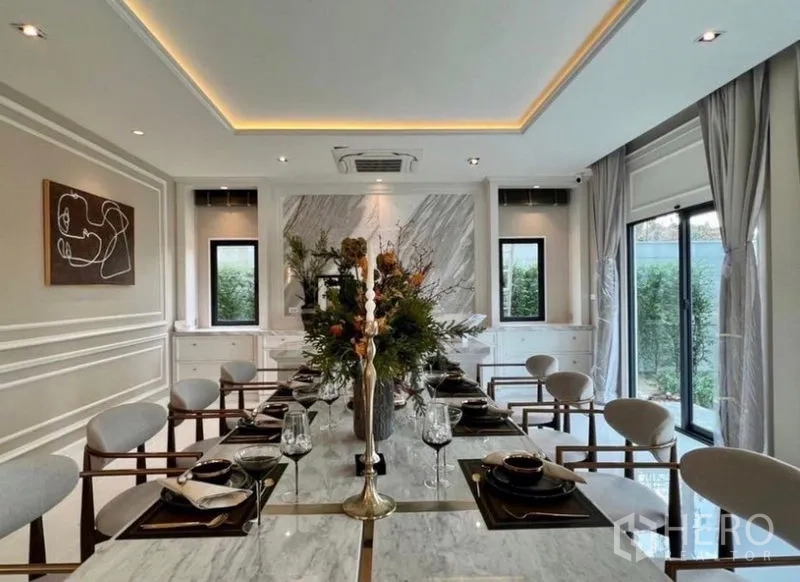 Detached House for sale in Bang Phli, Samut Prakan - Formal dining room featuring long marble table and garden-view windows.