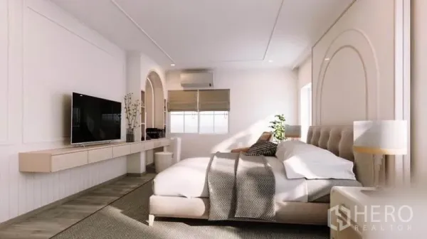 Detached House for rent in Bang Phli, Samut Prakan - Spacious master bedroom with upholstered bed, large windows and TV wall unit.