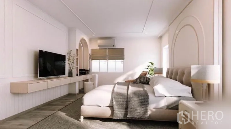 Detached House for rent in Bang Phli, Samut Prakan - Spacious master bedroom with upholstered bed, large windows and TV wall unit.