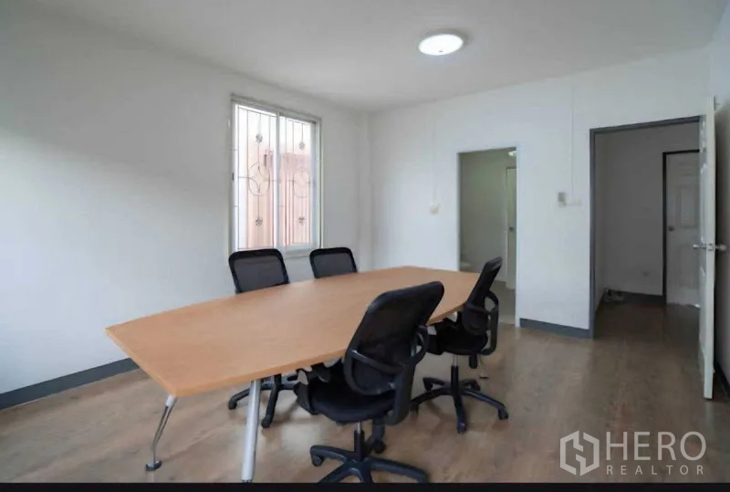 Home Office for rent or sale in Lat Krabang, Bangkok - Meeting room with conference table and black swivel chairs.