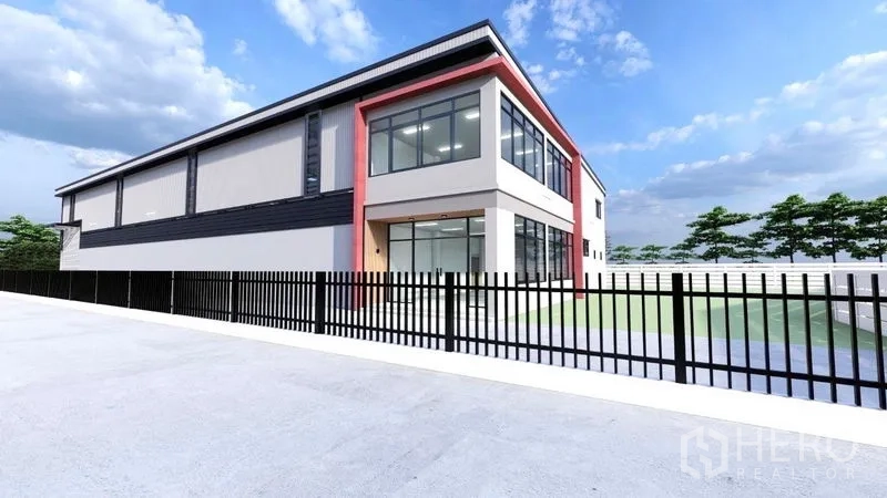 Warehouse for rent or sale in Lam Luk Ka, Pathum Thani - Exterior render of the warehouse with glass‑fronted office wing and perimeter fence.