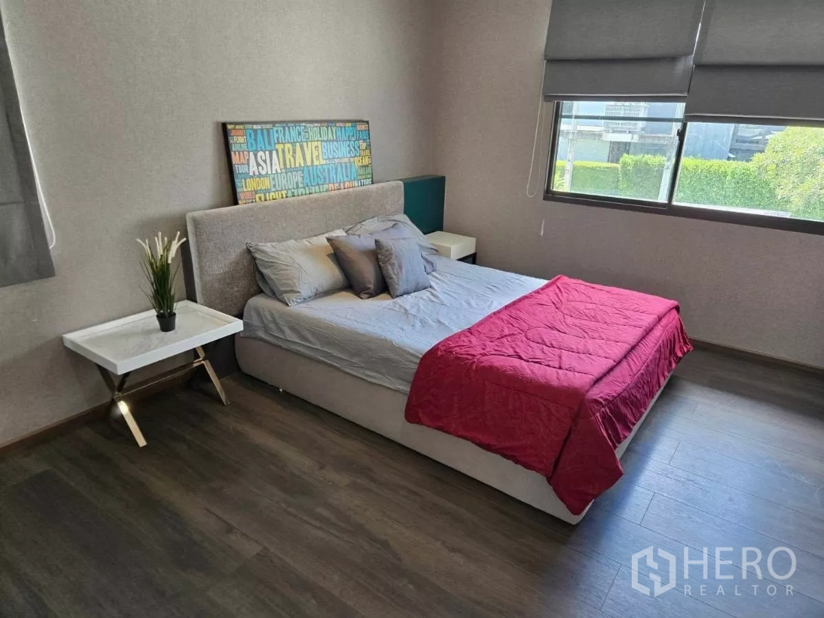 Detached House for rent or sale in Bang Phli, Samut Prakan - Bright bedroom with large window, garden outlook, and red throw blanket.