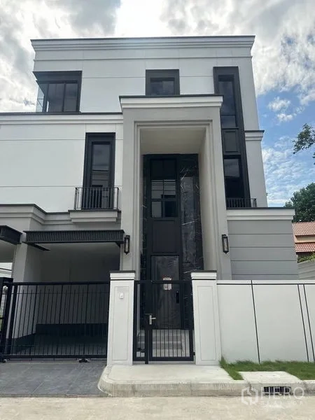 Detached House for rent - Grand front entry with double-height doorway and minimalist metal railings.
