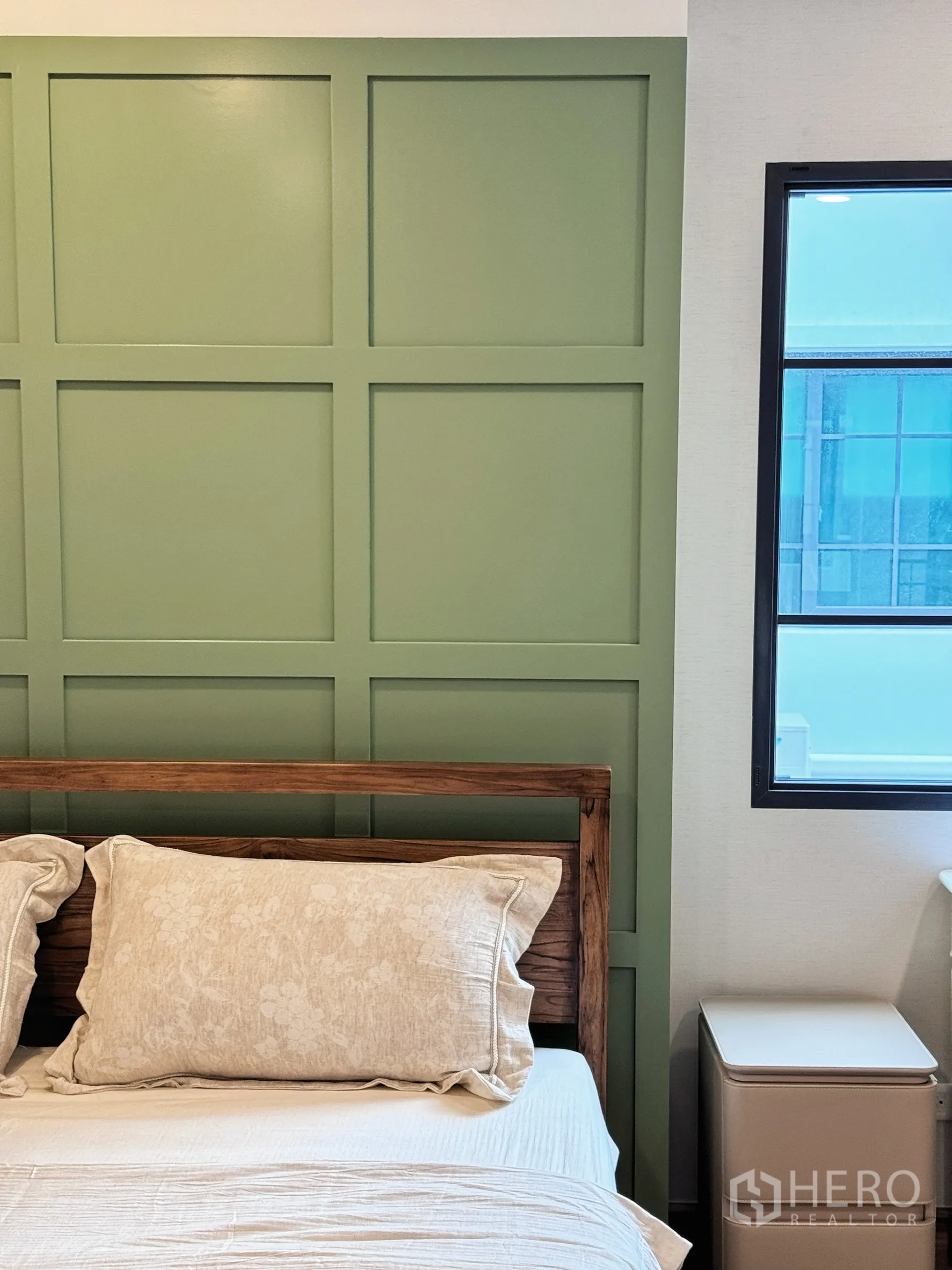 Detached House for rent in Bang Phli, Samut Prakan - Close-up of green paneled feature wall and wooden bed frame.