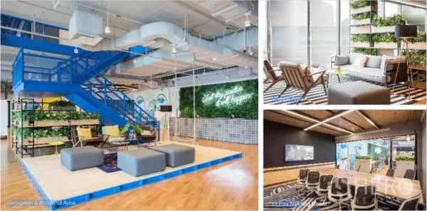 Office Space for rent in Sathon, Bangkok - Colorful reception and breakout areas with a blue staircase, lounge seating and an adjacent meeting room.