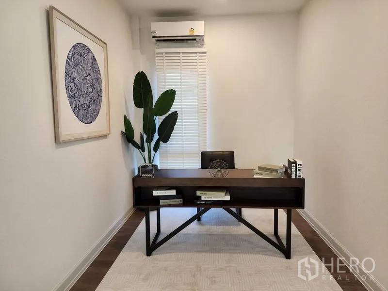 Detached House for rent or sale - Bright home office with dark wood desk, wall art and a window with blinds