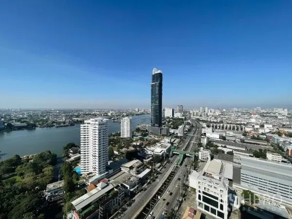 Condominium for rent or sale in Bang Kho Laem, Bangkok - High-floor cityscape of Bang Kho Laem with the Chao Phraya River under a clear blue sky.
