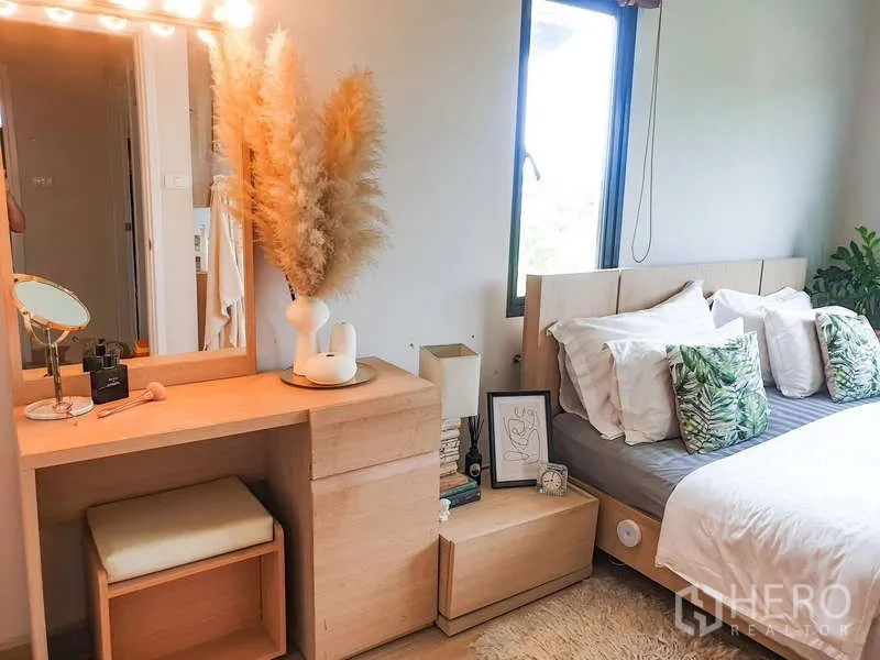 Detached House for sale in Bang Phli, Samut Prakan - Cozy bedroom with light wood dressing table and soft lighting