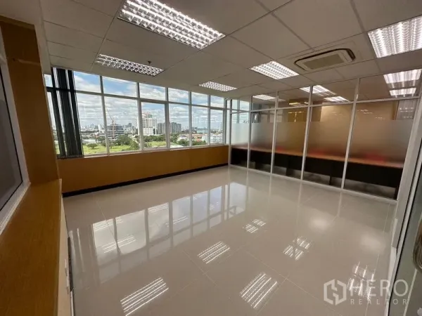 Office Space for rent in Suan Luang, Bangkok - Bright empty office with large windows, city views and ceiling cassette air-conditioning.