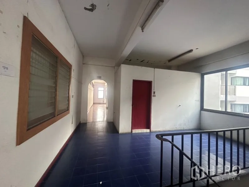 Office Space for rent - Upper-level corridor and stair lobby with natural light