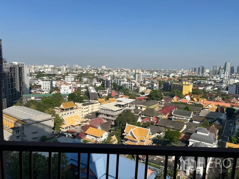 Condominium for rent or sale in Watthana, Bangkok - High-floor balcony view over Ekkamai neighborhood and the Bangkok skyline