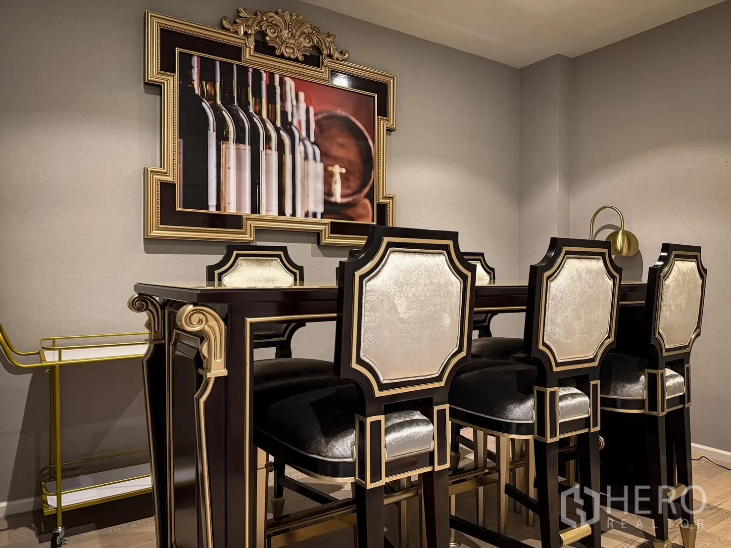 Detached House for rent or sale in Lak Si, Bangkok - Intimate bar-height dining set with ornate black-and-gold chairs and framed wine artwork.