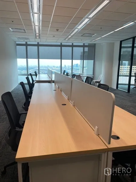 Office Space for rent in Dusit, Bangkok - Workstations aligned toward full-height windows providing skyline views and natural light.