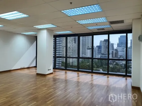 Office Space for rent in Watthana, Bangkok - Open-plan office with floor-to-ceiling corner windows and Bangkok skyline views.