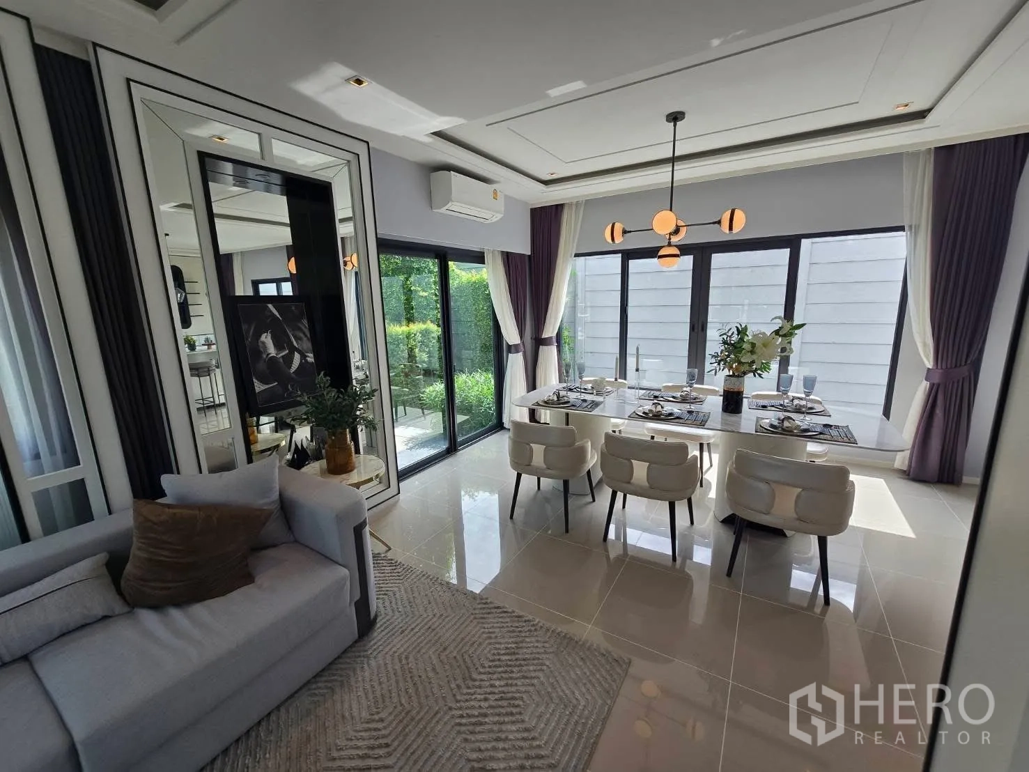 Semi-detached House for rent in Bang Phli, Samut Prakan - Open-plan living and dining with sliding glass doors to garden.