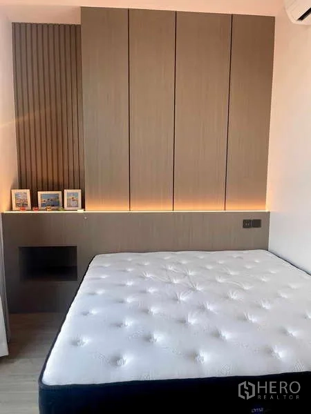 Condominium for rent - Cozy bedroom with panel headboard, underlit feature wall and new mattress.