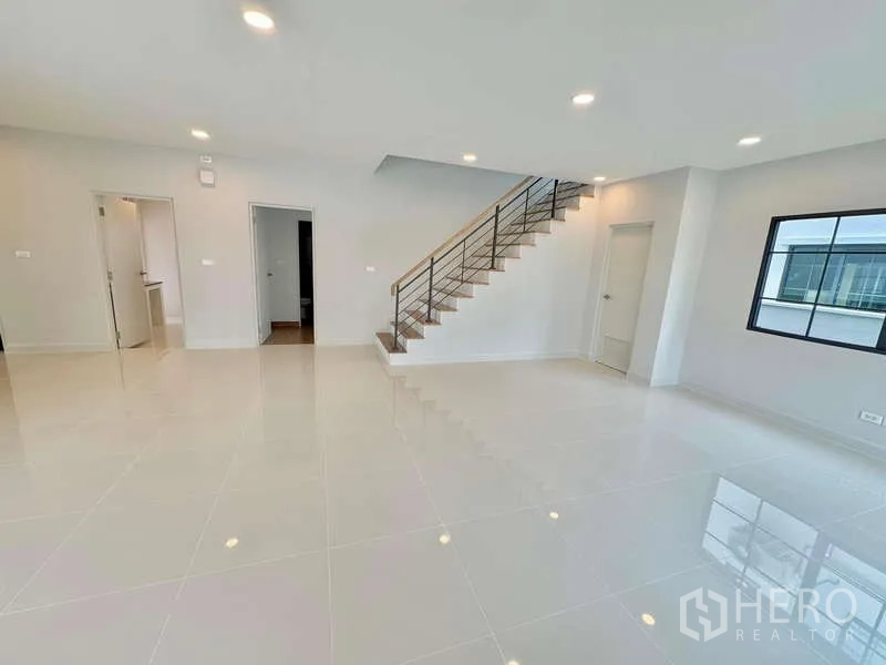 Detached House for sale in Bang Phli, Samut Prakan - Wide living zone beside the staircase with access to utility rooms.