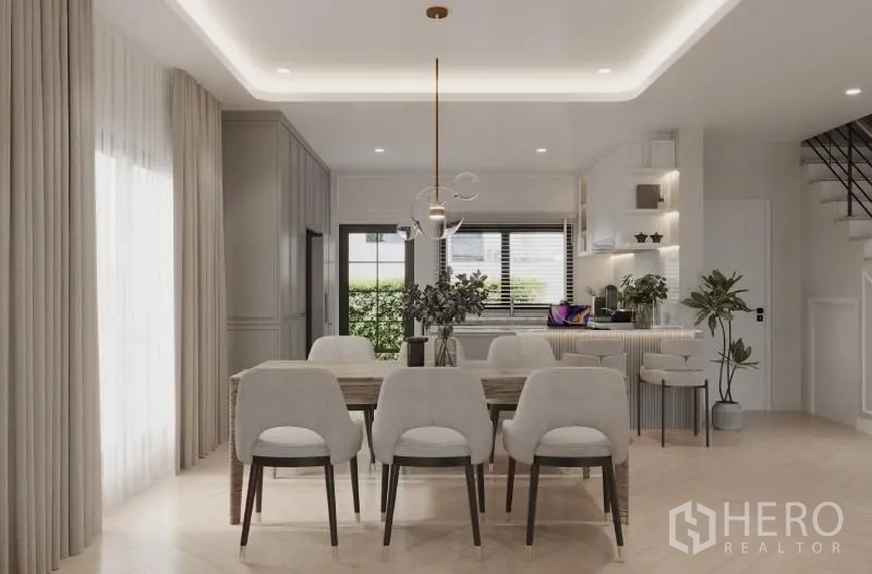 Detached House for rent in Bang Phli, Samut Prakan - Dining room view toward kitchen island with pendant light and built-in storage.