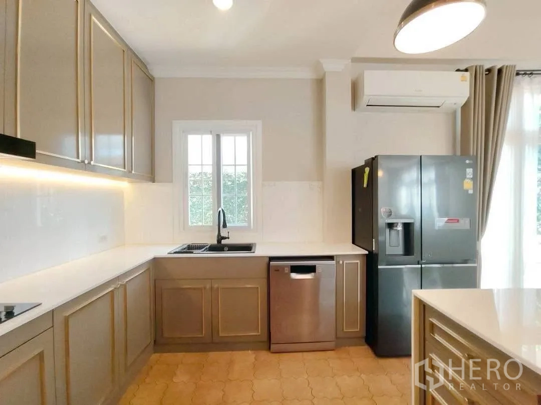 Detached House for rent in Bang Na, Bangkok - Kitchen corner with window, dishwasher, and double-door fridge.