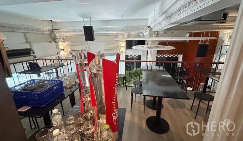 Shophouse for sale - Mezzanine tables overlooking stage area with classic moldings.