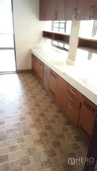 Office Space for rent in Sathon, Bangkok - Pantry with long countertops, upper cabinets, and tiled floor.