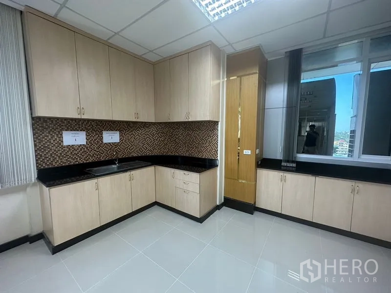 Office Space for rent in Suan Luang, Bangkok - Wide view of lobby and reception with glass partitioned meeting rooms.