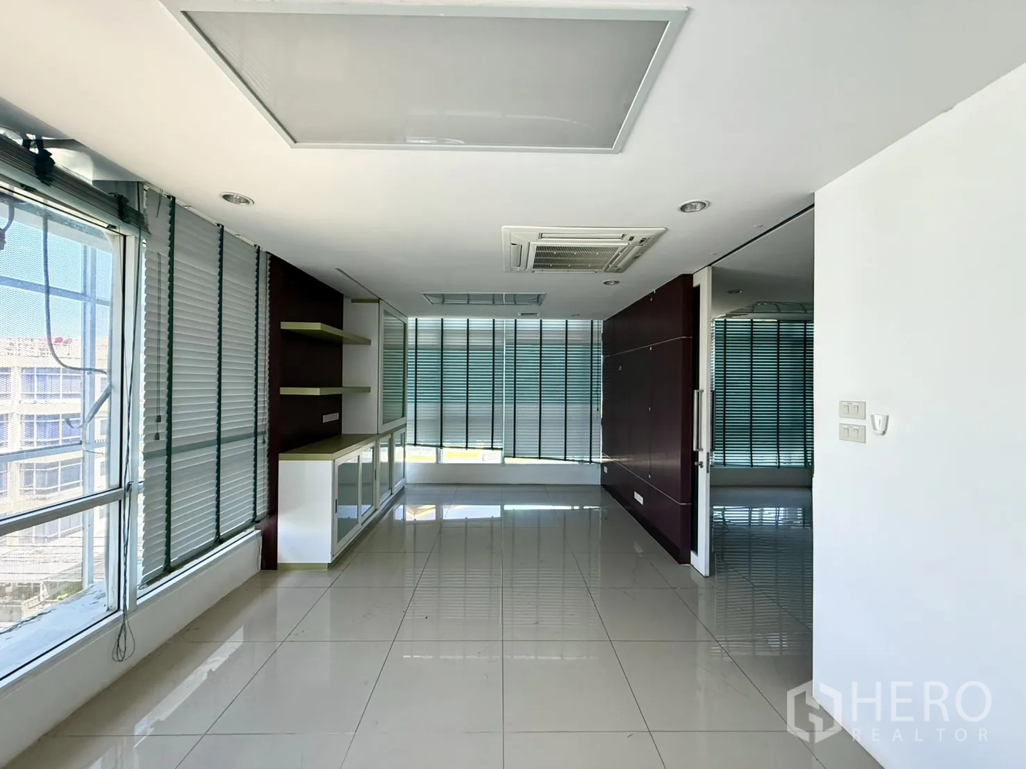 Office Space for rent in Bueng Kum, Bangkok - Upper-floor office with blinds, built-in shelves and ceiling AC.