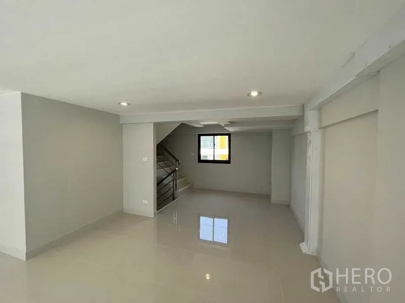 Home Office for rent - Open area with staircase and window, suitable for meeting zone or lounge.