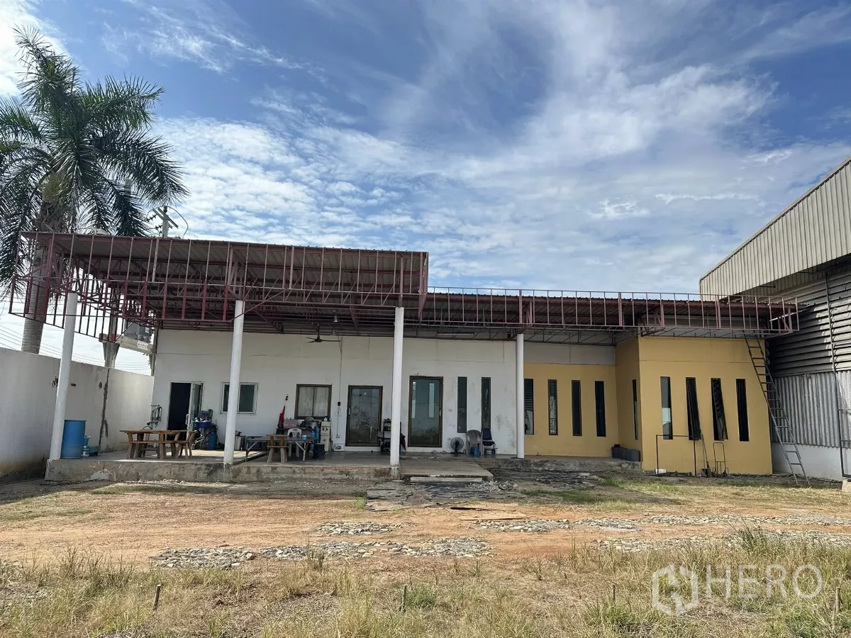 Warehouse for sale in Nong Chok, Bangkok - Single-storey office building with covered terrace adjoining the warehouse and grassed yard.