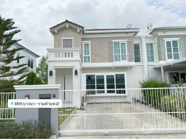 Detached House for rent or sale in Prawet, Bangkok - Two-storey detached house facade with gated driveway and small front lawn.