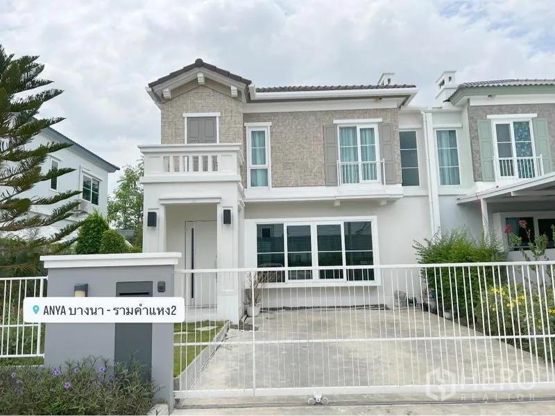 Detached House for rent or sale in Prawet, Bangkok - Two-storey detached house facade with gated driveway and small front lawn.