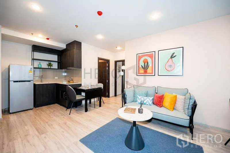 Condominium for rent or sale - Bright open-plan lounge with kitchen and dining in XT Huaikhwang condo.