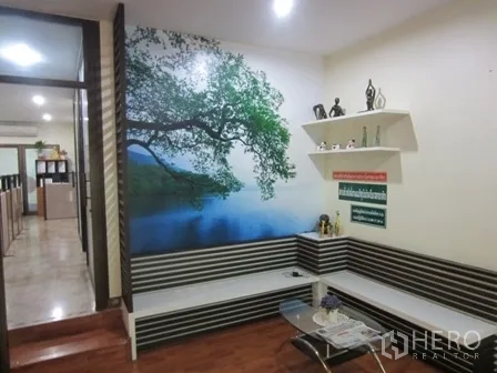 Home Office for rent or sale in Wang Thonglang, Bangkok - Lounge corner with wall mural, built-in bench seating and shelves.