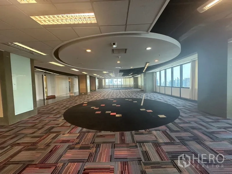 Office Space for rent in Khlong Toei, Bangkok - Central collaboration area with round ceiling detail and panoramic windows.