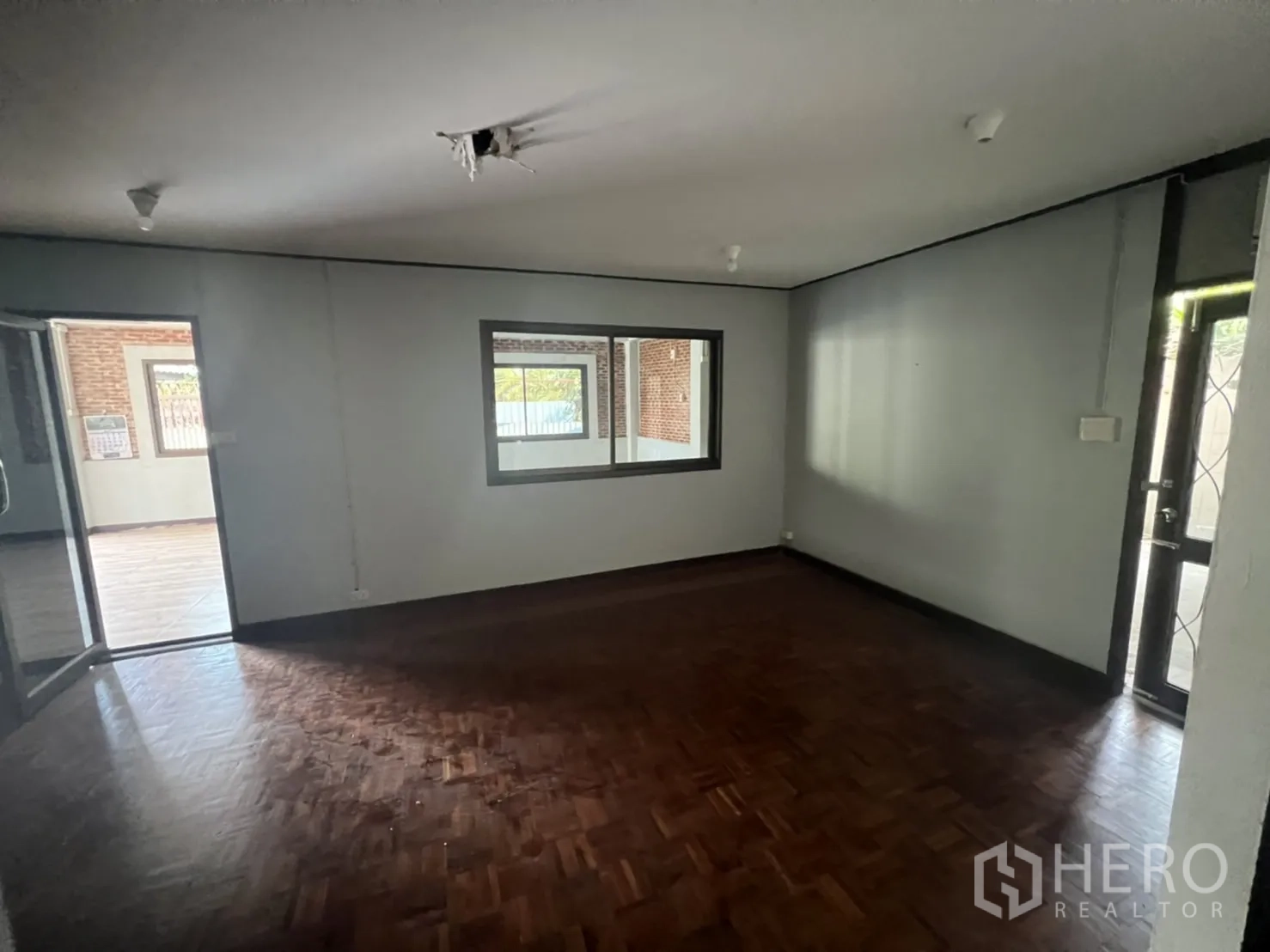 Home Office for rent in Watthana, Bangkok - Ground-floor office room with internal window to the main hall.