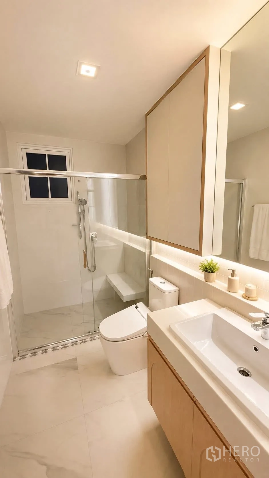 Detached House for rent or sale in Bang Phli, Samut Prakan - Modern bathroom with glass-enclosed shower, toilet, and vanity sink.