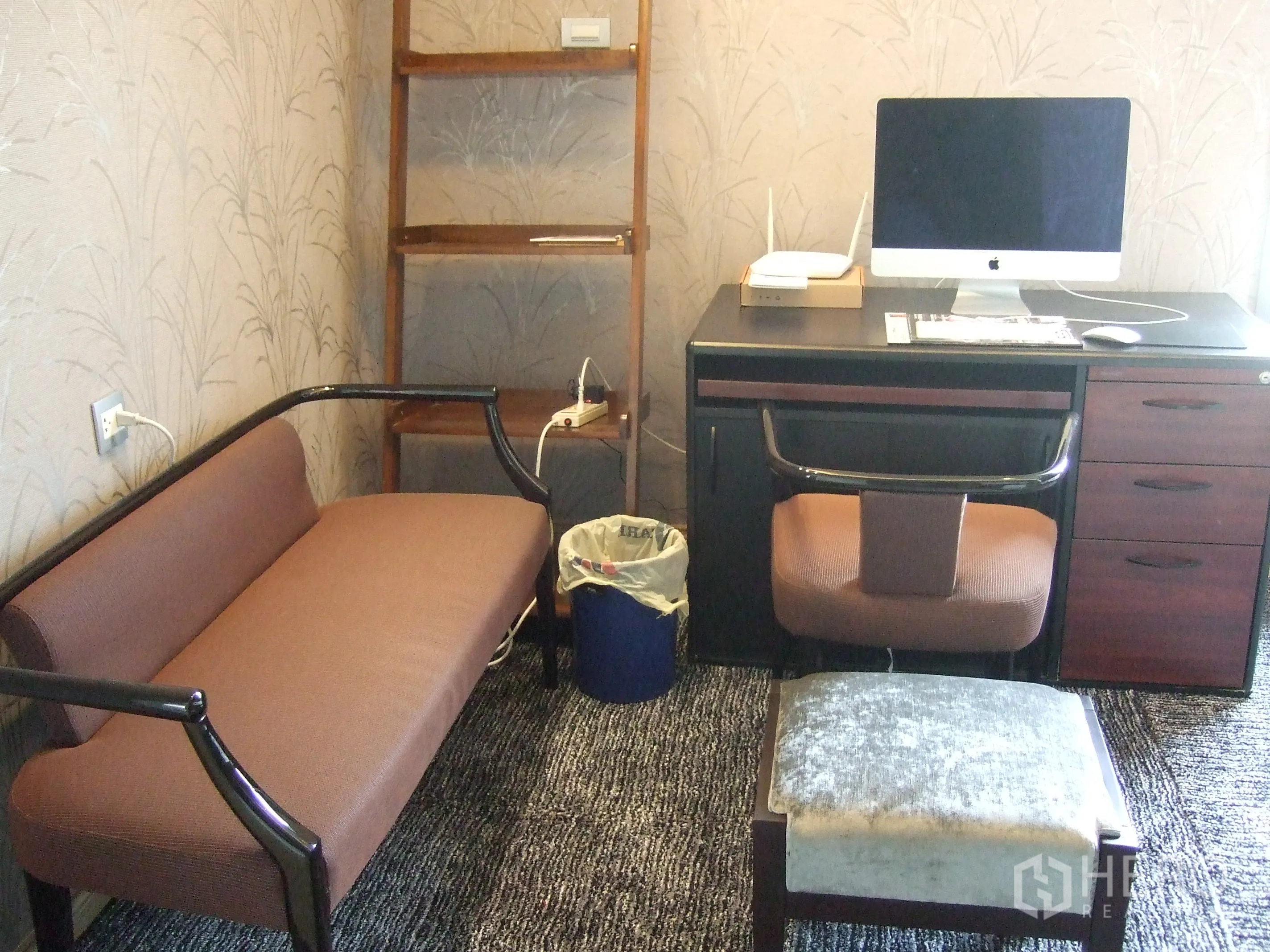 Condominium for rent or sale in Watthana, Bangkok - Dedicated home office nook with desk, chair, shelving, and small sofa.
