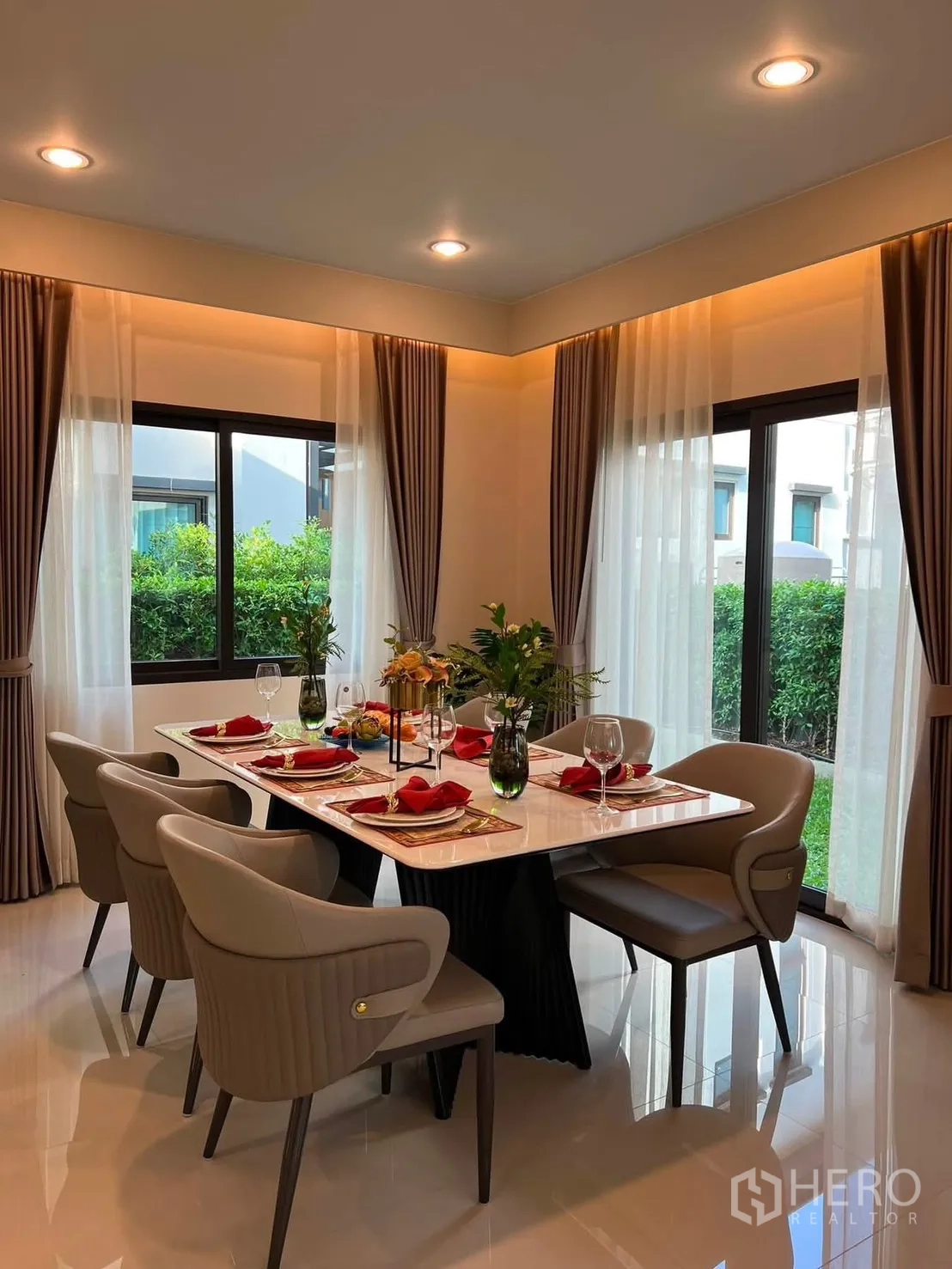 Detached House for rent in Bang Phli, Samut Prakan - Dining area set for six with windows overlooking green hedges.