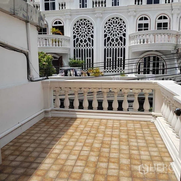 Home Office for rent in Watthana, Bangkok - Small balcony with balustrade overlooking ornate European-style facades.