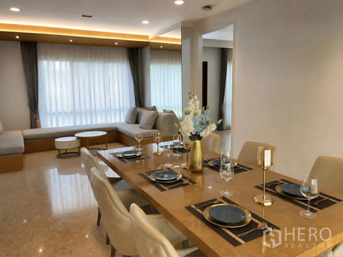 Detached House for rent or sale in Saphan Sung, Bangkok - Close view of dining table and lounge under recessed lighting.