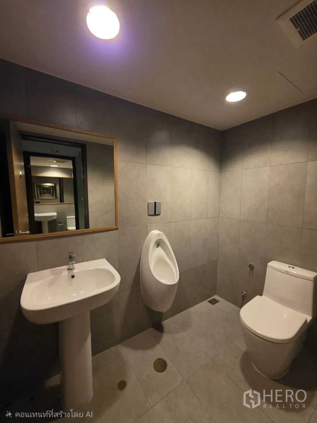Retail Space for rent in Khlong Toei, Bangkok - Modern restroom with sink, urinal, and toilet.