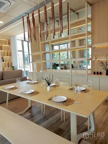 Detached House for rent in Saphan Sung, Bangkok - Dining area with light wood table set for six, mirrored shelving and vertical slat feature wall in Japandi style.