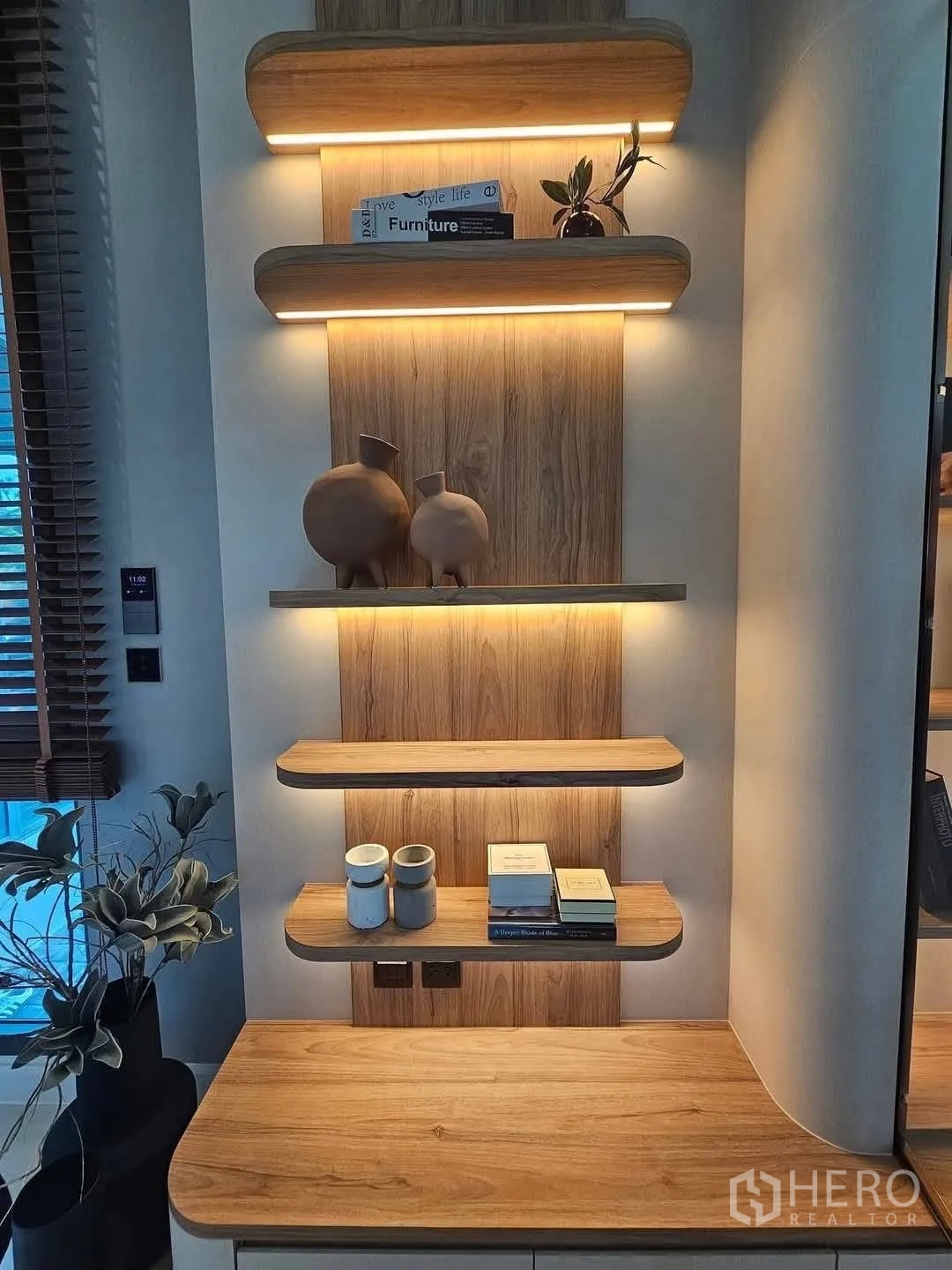 Detached House for rent or sale in Suan Luang, Bangkok - Close-up of wood floating shelves with warm LED lighting.