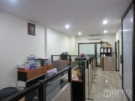 Home Office for rent or sale in Wang Thonglang, Bangkok - Work area with partitioned cubicles and ceiling lights.